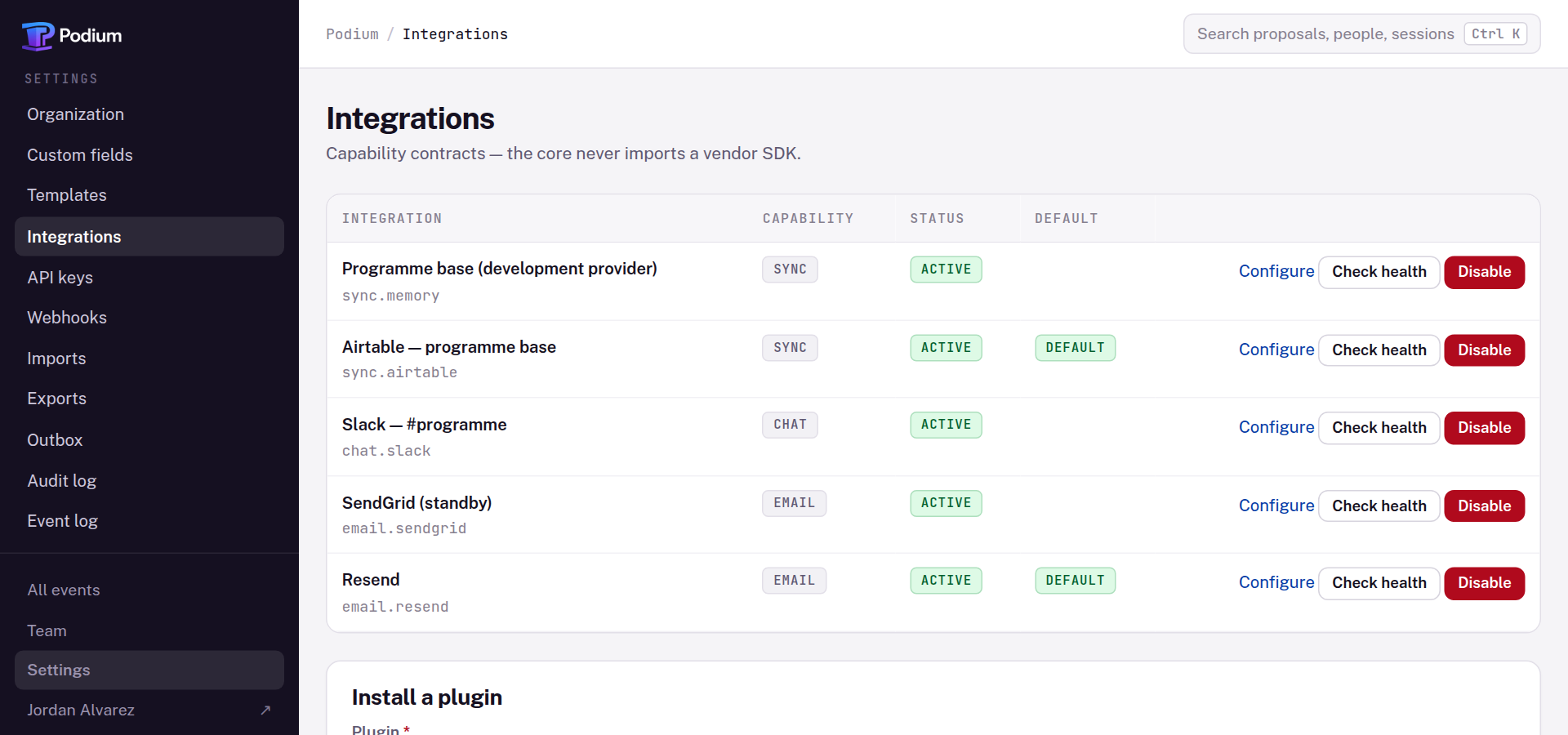 The integrations screen listing five installed adapters — Resend and SendGrid for email, Slack for chat, and two sync providers including Airtable — each active, with Resend and Airtable flagged as the default for their capability.